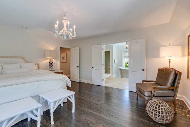 bedroom featuring a chandelier, dark wood finished floors, connected bathroom, and baseboards