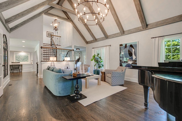 living area featuring a chandelier, high vaulted ceiling, wood finished floors, and stairway