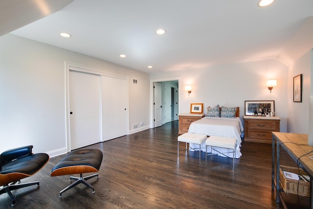 bedroom with recessed lighting, wood finished floors, a closet, and baseboards