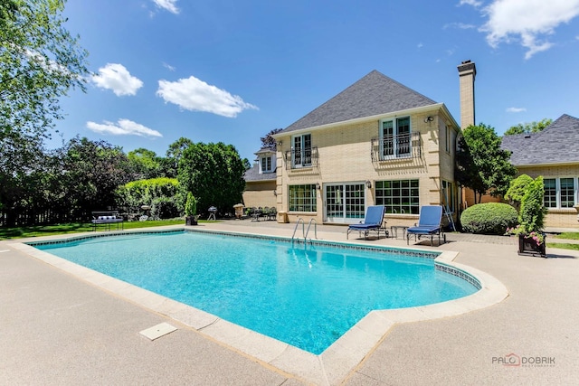 pool featuring a patio area