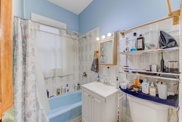 full bathroom with vanity, toilet, and shower / bath combo