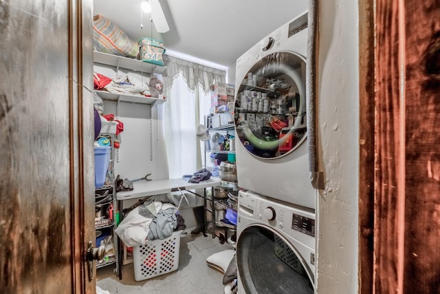 laundry area with stacked washing maching and dryer