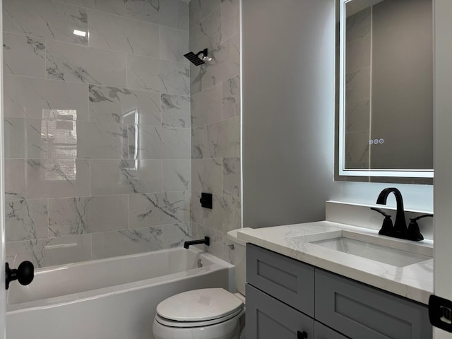 bathroom with toilet, vanity, and  shower combination