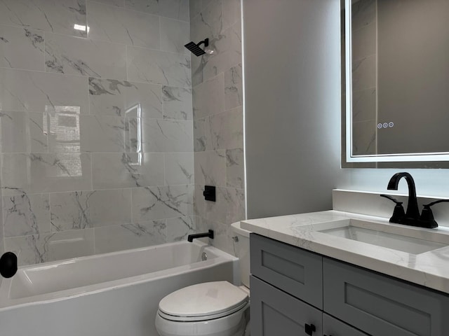 bathroom with toilet, washtub / shower combination, and vanity