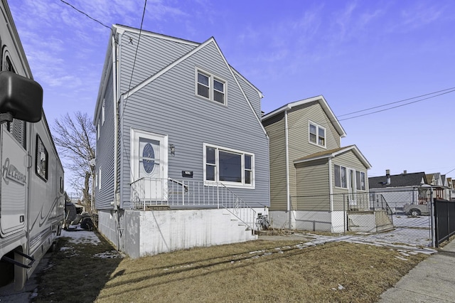 view of front of house featuring fence