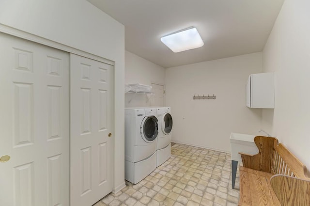 clothes washing area with washer and dryer