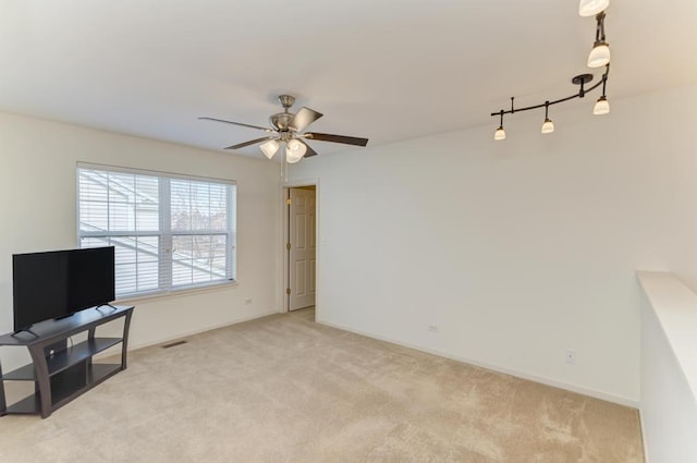 carpeted living room with ceiling fan