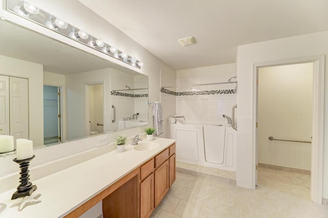 bathroom featuring vanity and a tub