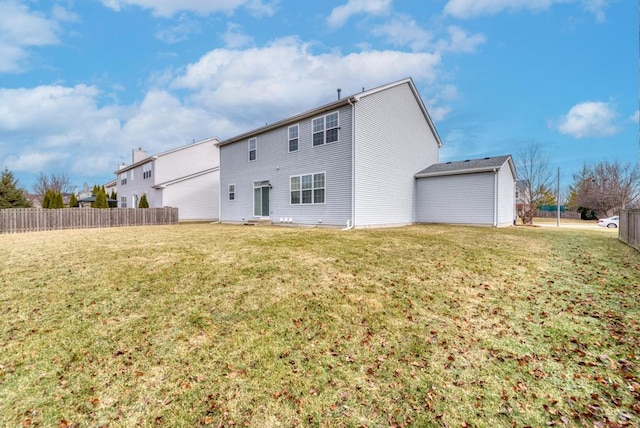 rear view of property with a yard