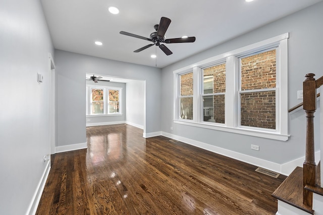 interior space featuring ceiling fan and dark hardwood / wood-style flooring