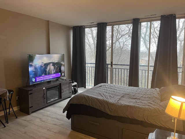 bedroom with light hardwood / wood-style flooring