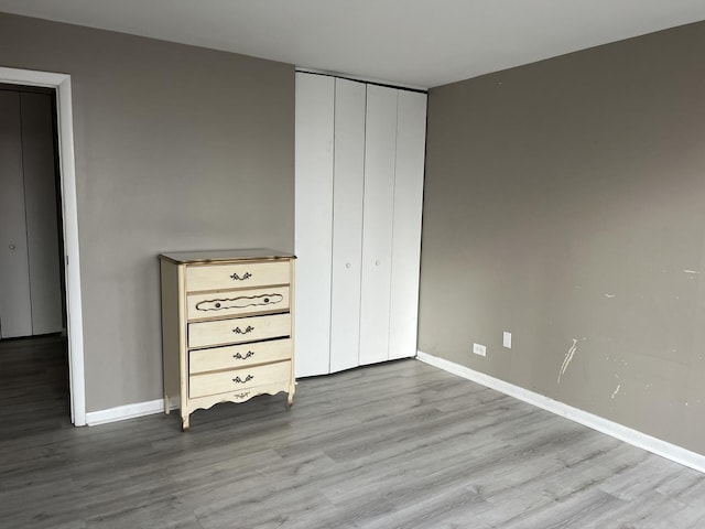 unfurnished bedroom with light hardwood / wood-style floors