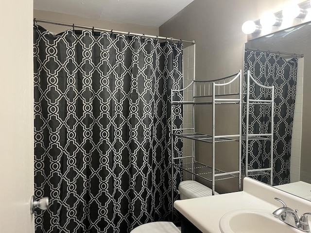 bathroom with vanity, a shower with curtain, and toilet