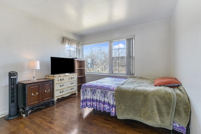 bedroom with wood finished floors