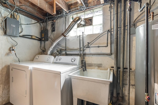 clothes washing area featuring gas water heater, electric panel, laundry area, independent washer and dryer, and a sink