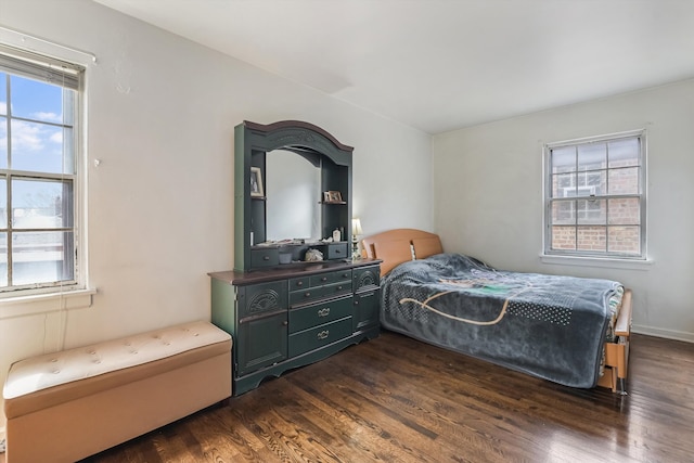 bedroom with dark wood-type flooring