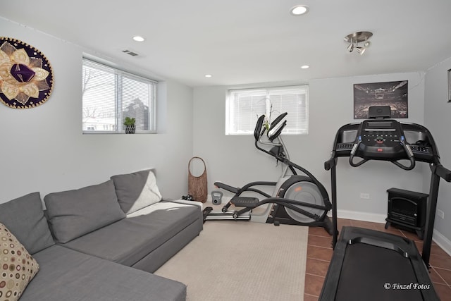 exercise room with tile patterned flooring