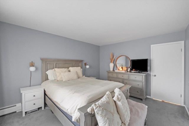 carpeted bedroom featuring a baseboard heating unit