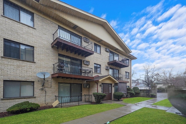 view of property with a wall mounted air conditioner