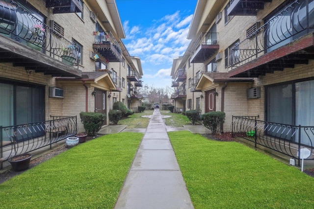 view of home's community featuring a yard