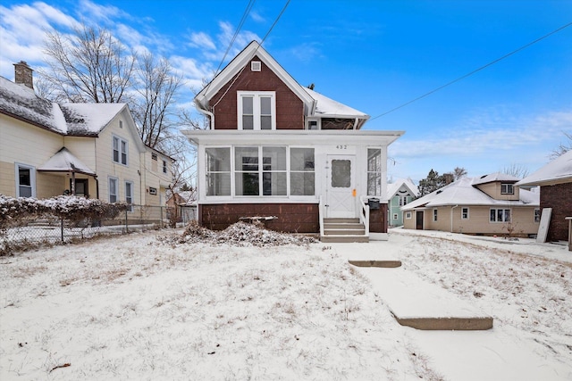 view of front of property featuring a sunroom