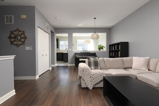 living room with dark hardwood / wood-style floors