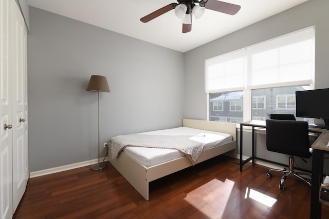 bedroom featuring ceiling fan and dark hardwood / wood-style flooring