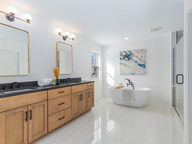 bathroom featuring vanity and shower with separate bathtub