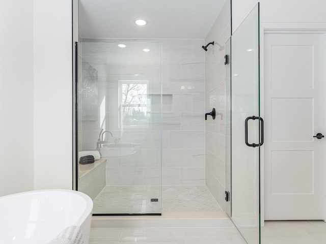 bathroom with tile patterned floors and plus walk in shower