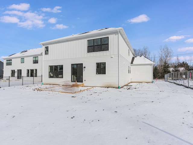 view of snow covered house