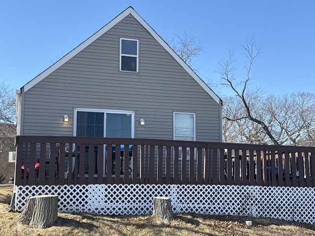 rear view of house with a wooden deck