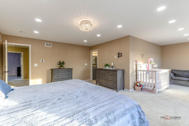 bedroom featuring light carpet, baseboards, visible vents, and recessed lighting