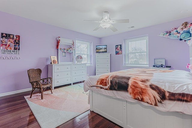 bedroom with a ceiling fan, baseboards, visible vents, and dark wood-style flooring