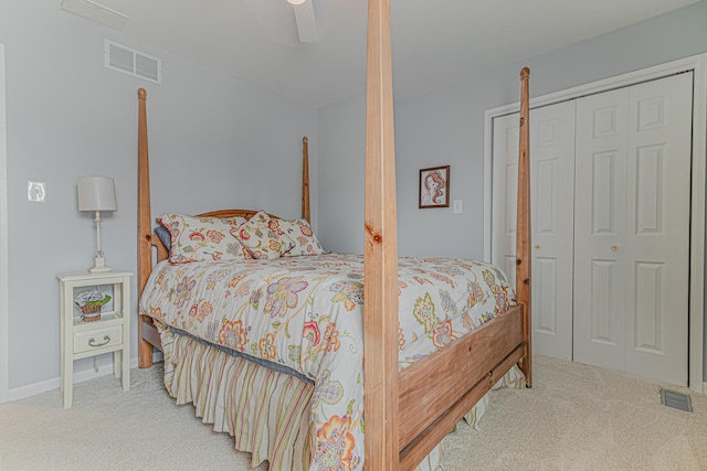 bedroom featuring carpet, visible vents, and a closet