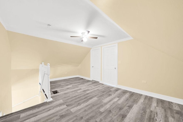 bonus room with ceiling fan, wood-type flooring, and lofted ceiling