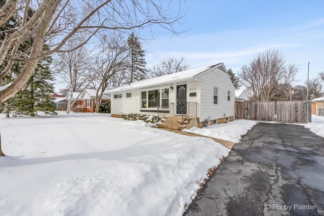 single story home with fence