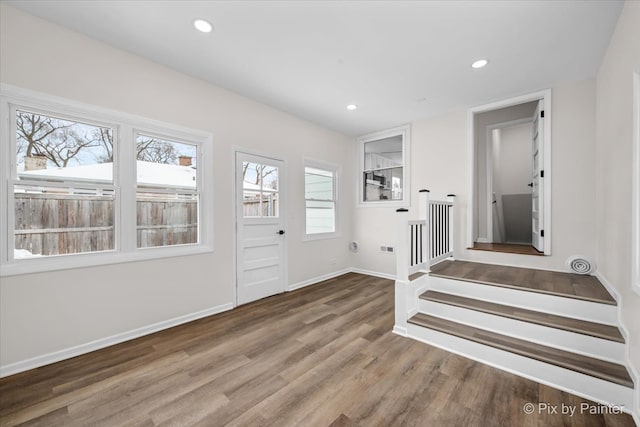 interior space with stairs, recessed lighting, baseboards, and wood finished floors