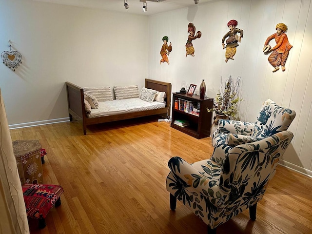 interior space featuring baseboards and wood finished floors