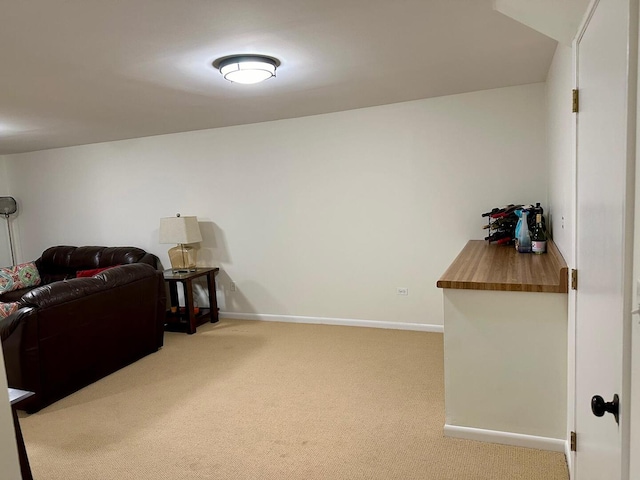 sitting room with carpet flooring and baseboards