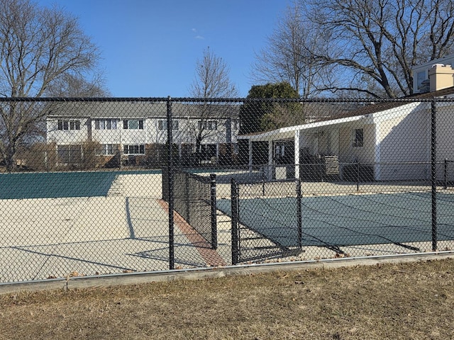 view of sport court with fence