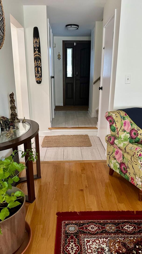 entryway featuring baseboards and light wood-type flooring