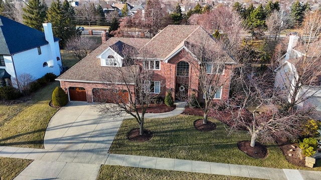 3642 Monarch Cir, Naperville, IL 60564 - traditional home with brick siding, a garage, a front yard, and concrete driveway