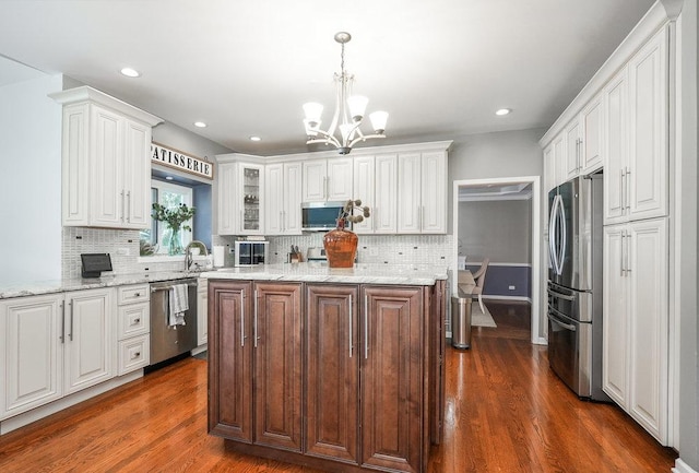 3642 Monarch Cir, Naperville, IL 60564 - kitchen featuring an inviting chandelier, dark wood finished floors, white cabinets, and stainless steel appliances