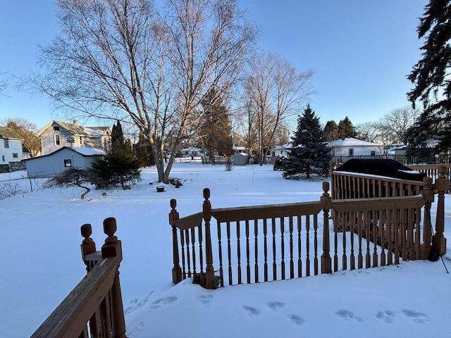 view of yard layered in snow