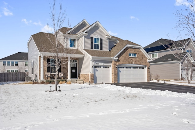 view of front of home with a garage, brick siding, central AC, and roof with shingles