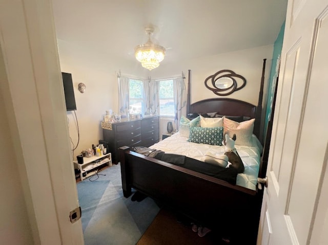 bedroom featuring a chandelier