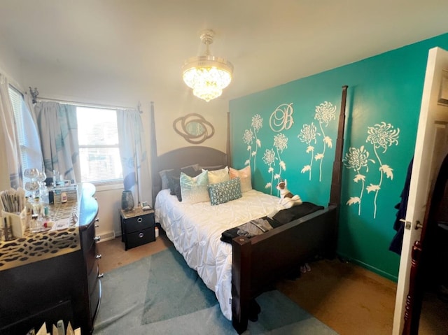 bedroom featuring a notable chandelier and carpet floors