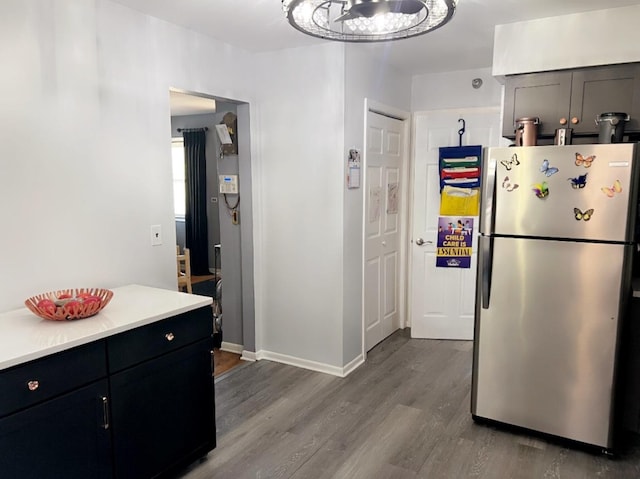 kitchen featuring hardwood / wood-style floors and stainless steel fridge