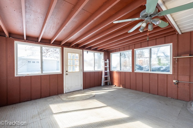unfurnished sunroom with lofted ceiling