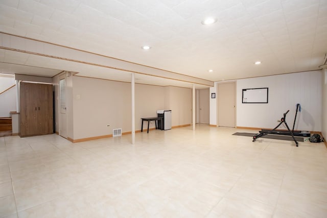 workout area with baseboards, visible vents, recessed lighting, and light floors